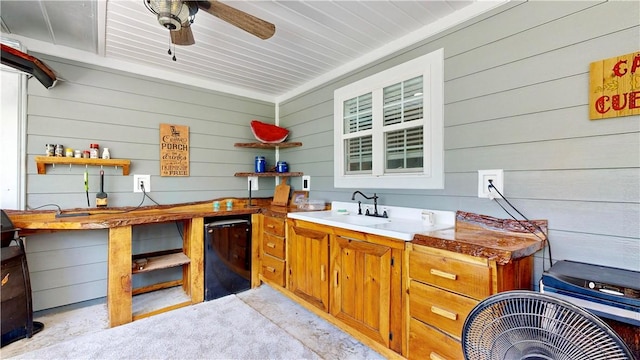 exterior space featuring black fridge, ceiling fan, and wooden walls