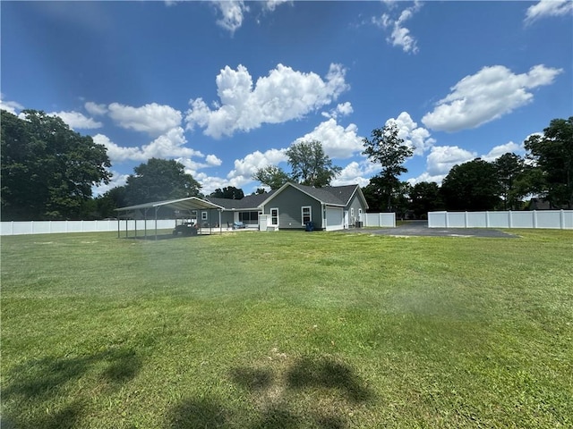 view of yard with a carport
