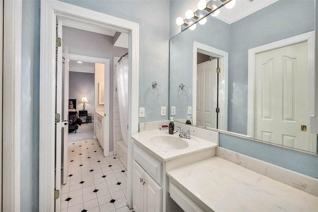 bathroom with shower / bath combo with shower curtain and vanity