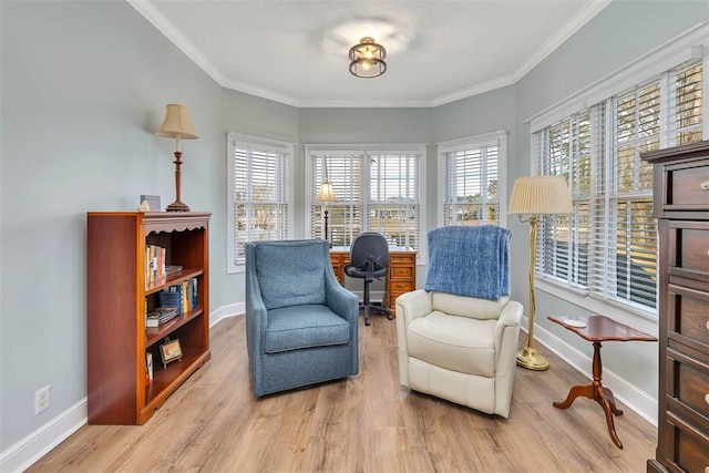 living area with crown molding and hardwood / wood-style flooring