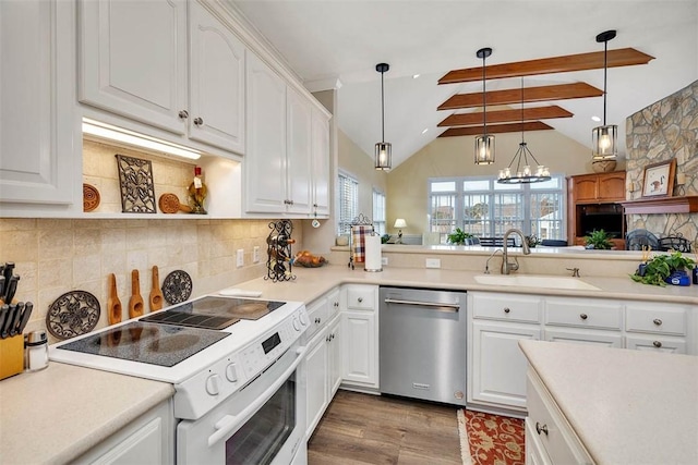 kitchen with sink, white cabinetry, electric range, and stainless steel dishwasher