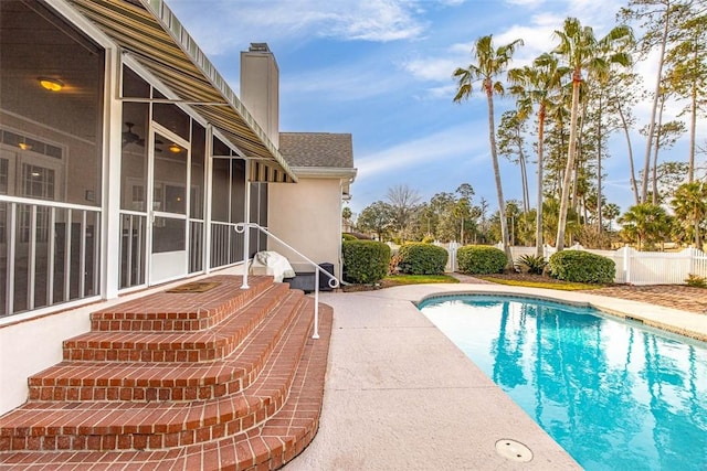 view of pool with a sunroom