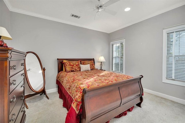 carpeted bedroom featuring ceiling fan and ornamental molding