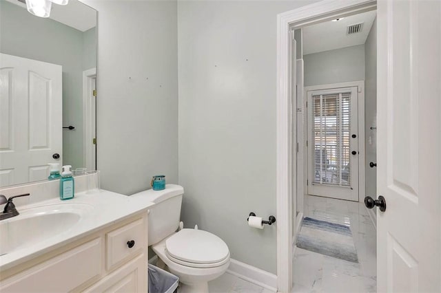 bathroom with toilet and vanity