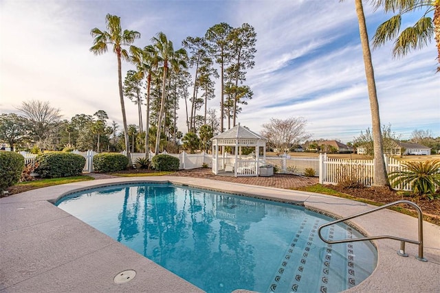 view of swimming pool featuring a gazebo