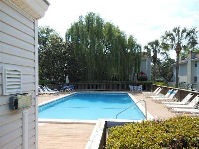 view of pool with a wooden deck