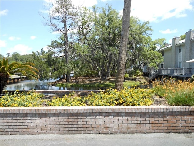 view of property's community featuring a water view