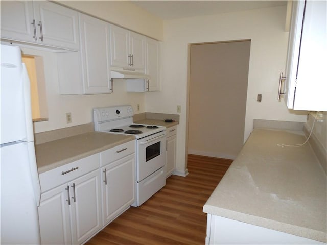 kitchen with white appliances, light hardwood / wood-style flooring, and white cabinetry