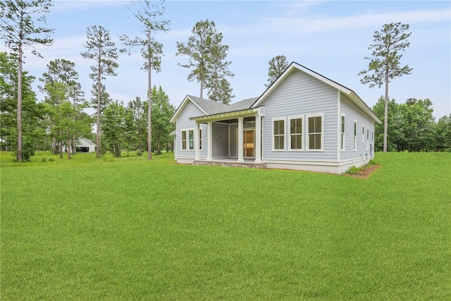 231 Salt Creek Way E, Brunswick, GA 31523 - back of house with a lawn