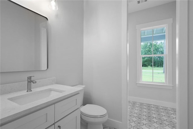 231 Salt Creek Way E, Brunswick, GA 31523 - bathroom with vanity, baseboards, and toilet