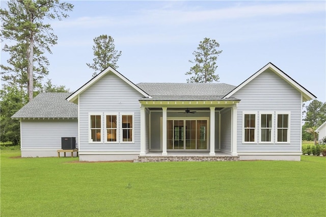 231 Salt Creek Way E, Brunswick, GA 31523 - rear view of house with a ceiling fan, a shingled roof, a lawn, and a patio area