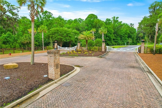 231 Salt Creek Way E, Brunswick, GA 31523 - view of home's community with view of wooded area and a gate