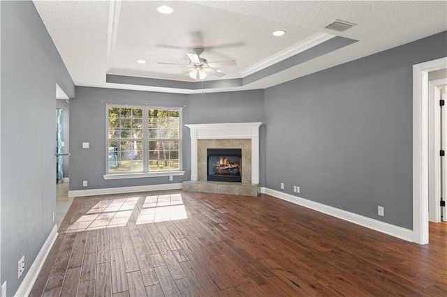 22 Millpond Cir, Brunswick, GA 31525 - unfurnished living room with crown molding, ceiling fan, a raised ceiling, hardwood / wood-style floors, and visible vents