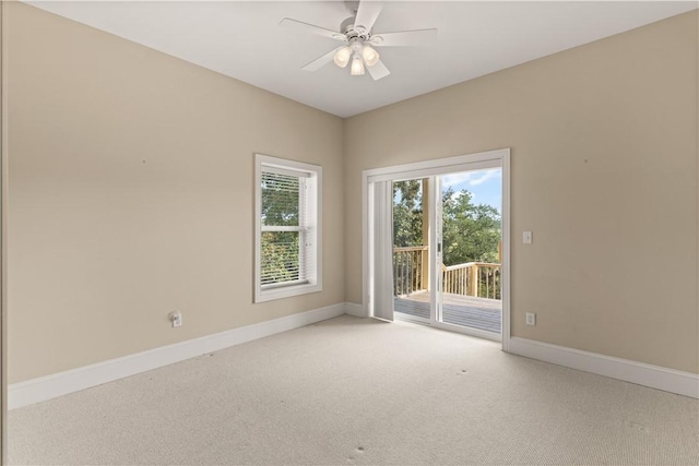 spare room featuring ceiling fan and carpet floors