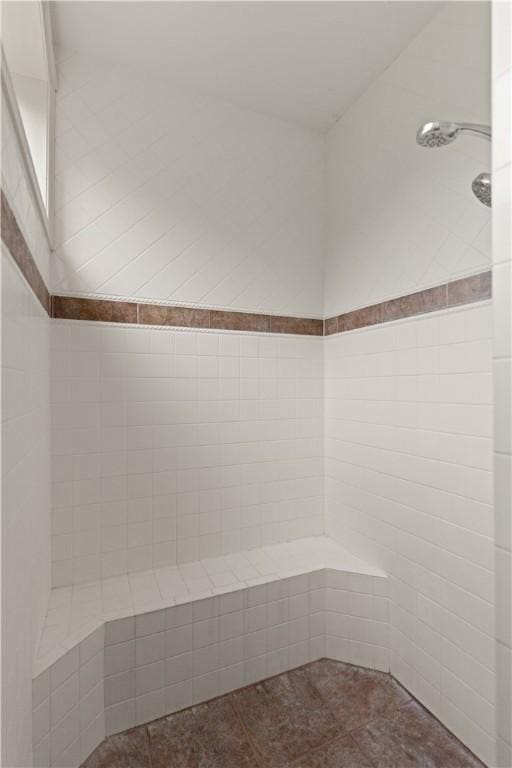 bathroom with tiled shower