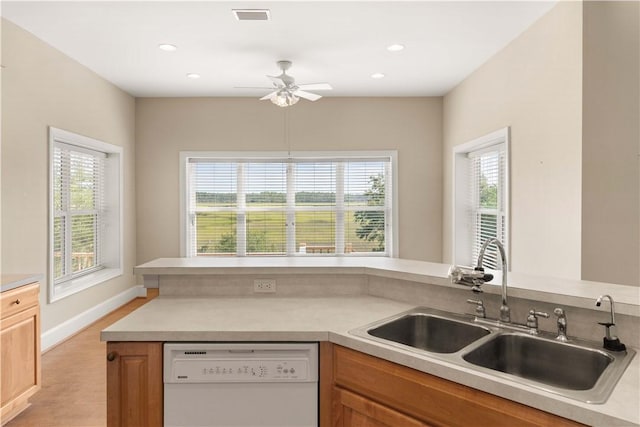 kitchen with ceiling fan, sink, and white dishwasher