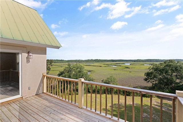 wooden terrace featuring a rural view