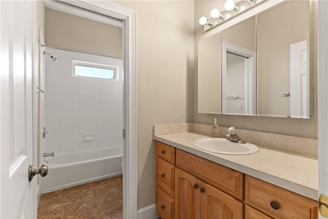 bathroom featuring shower / tub combination and vanity