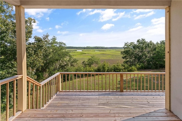 wooden terrace featuring a rural view