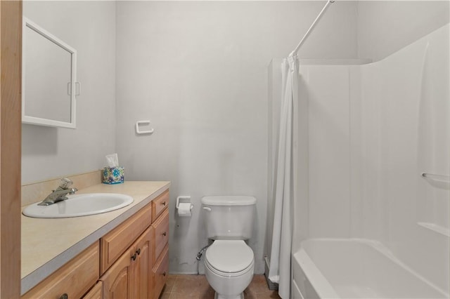 full bathroom featuring shower / bath combo with shower curtain, tile patterned flooring, vanity, and toilet