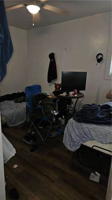 bedroom featuring ceiling fan and wood-type flooring