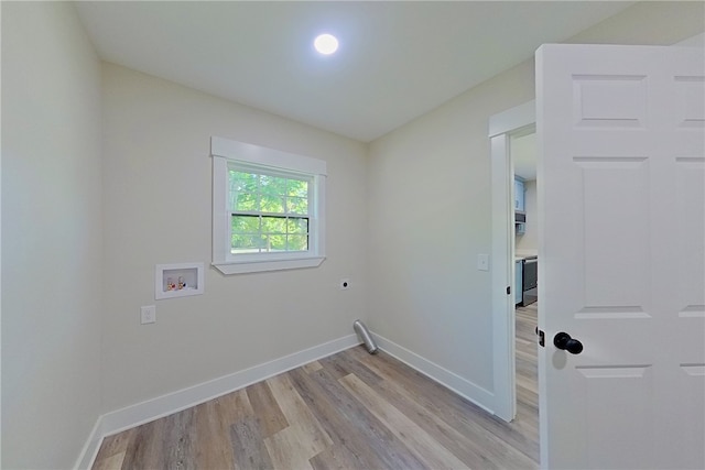 880 Miles Still Rd, Waycross, GA 31503 - laundry area with light wood-type flooring, electric dryer hookup, washer hookup, and baseboards