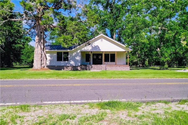 880 Miles Still Rd, Waycross, GA 31503 - single story home with a front yard and metal roof