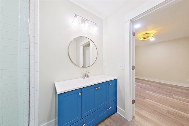 880 Miles Still Rd, Waycross, GA 31503 - bathroom featuring wood finished floors, vanity, and baseboards