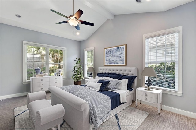 bedroom with multiple windows, lofted ceiling with beams, ceiling fan, and carpet flooring