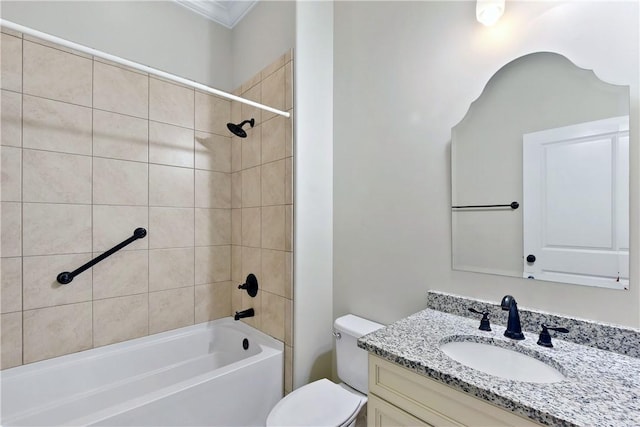 full bathroom with vanity, toilet, and tiled shower / bath combo