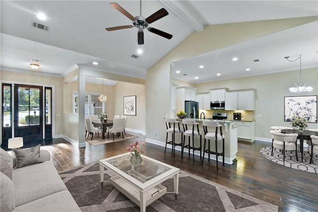 living room with crown molding, vaulted ceiling with beams, and dark hardwood / wood-style flooring