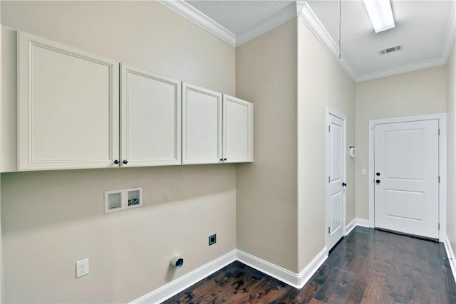 clothes washing area with electric dryer hookup, hookup for a washing machine, ornamental molding, and cabinets