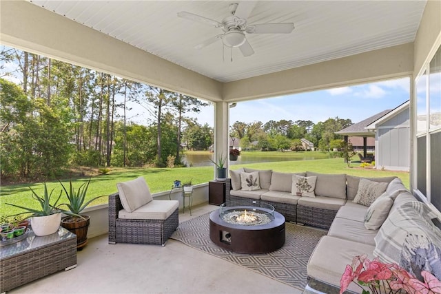 156 Allie Loop, Brunswick, GA 31525 - sunroom / solarium featuring an outdoor living space with a fire pit, ceiling fan, and view of wooded area