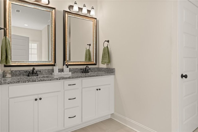 156 Allie Loop, Brunswick, GA 31525 - bathroom with double vanity and baseboards