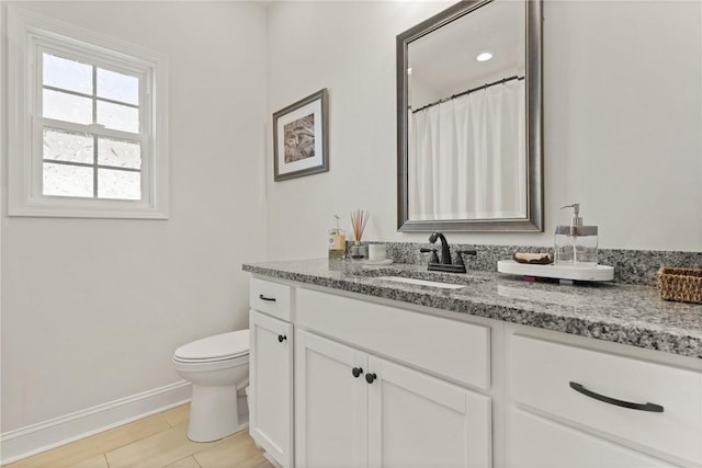 156 Allie Loop, Brunswick, GA 31525 - bathroom with baseboards, toilet, and vanity