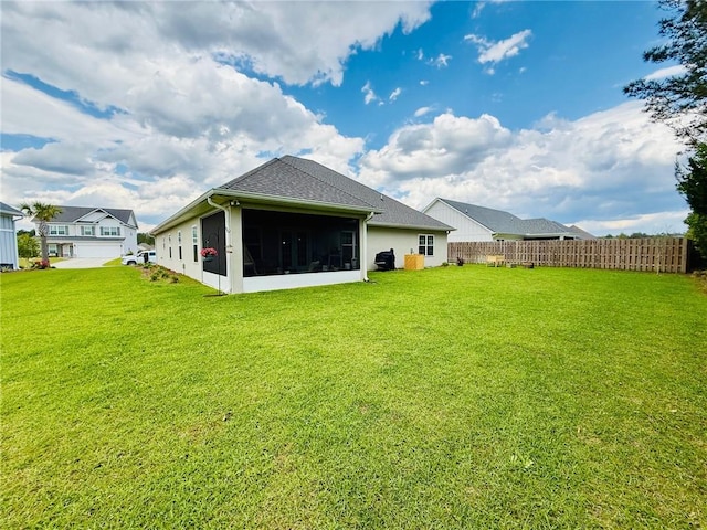156 Allie Loop, Brunswick, GA 31525 - back of property featuring a sunroom and a shingled roof