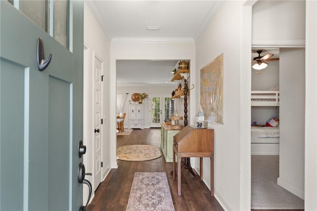 156 Allie Loop, Brunswick, GA 31525 - entryway featuring crown molding, dark wood-style floors, ceiling fan, and baseboards