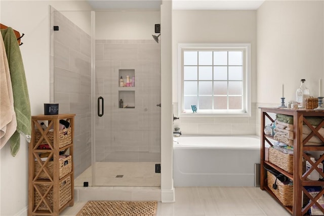 156 Allie Loop, Brunswick, GA 31525 - full bathroom featuring a stall shower, a bath, and tile patterned flooring