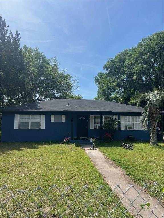 ranch-style house with a front lawn