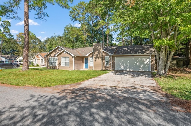 ranch-style house featuring a front lawn and a garage