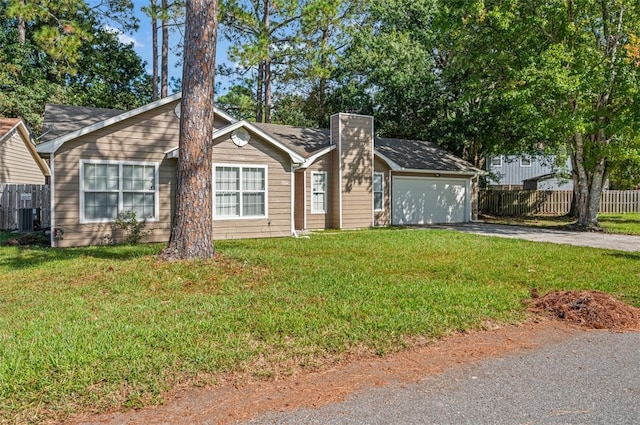 single story home featuring a front yard, a garage, and central AC unit