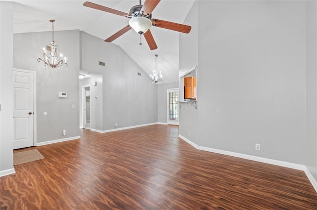 unfurnished living room featuring hardwood / wood-style floors, high vaulted ceiling, and ceiling fan with notable chandelier