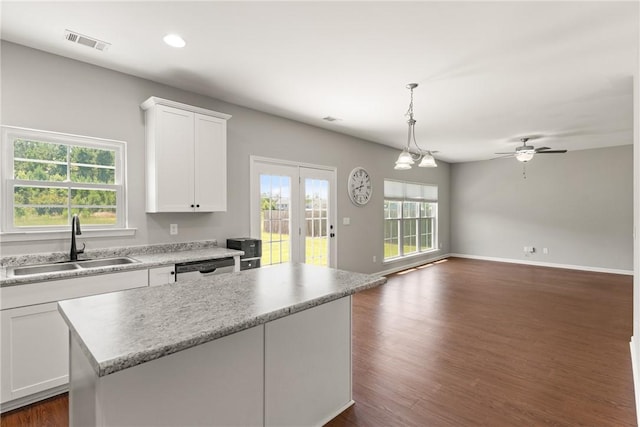 107 Heatherly Way, Brunswick, GA 31523 - kitchen with a center island, white cabinets, dark wood-style flooring, recessed lighting, and pendant lighting