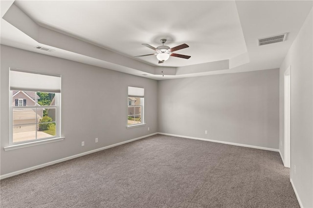 107 Heatherly Way, Brunswick, GA 31523 - empty room with a tray ceiling, ceiling fan, and carpet flooring