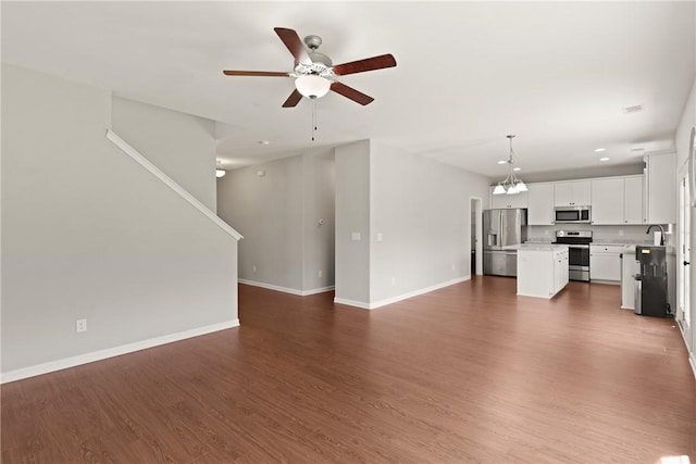 107 Heatherly Way, Brunswick, GA 31523 - unfurnished living room with ceiling fan and dark wood-style flooring