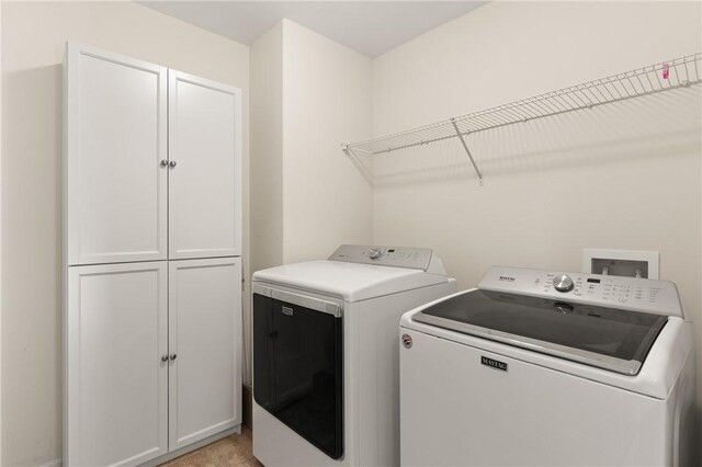 107 Heatherly Way, Brunswick, GA 31523 - washroom featuring cabinet space and washing machine and clothes dryer