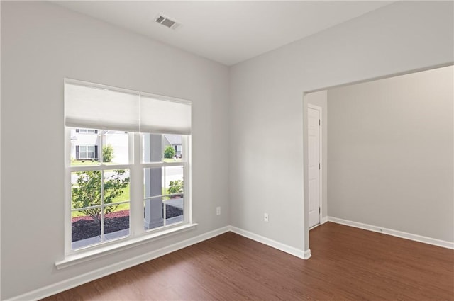 107 Heatherly Way, Brunswick, GA 31523 - unfurnished room with dark wood-type flooring and baseboards
