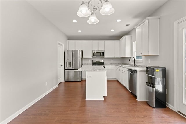 107 Heatherly Way, Brunswick, GA 31523 - kitchen featuring stainless steel appliances, a chandelier, a center island, recessed lighting, and dark wood-style flooring