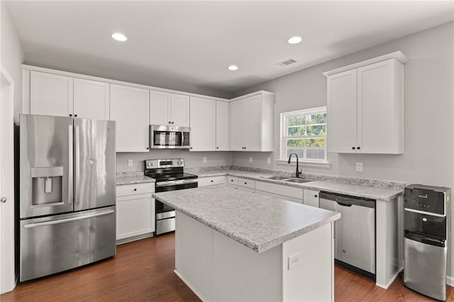 107 Heatherly Way, Brunswick, GA 31523 - kitchen with stainless steel appliances, recessed lighting, white cabinetry, a center island, and light countertops