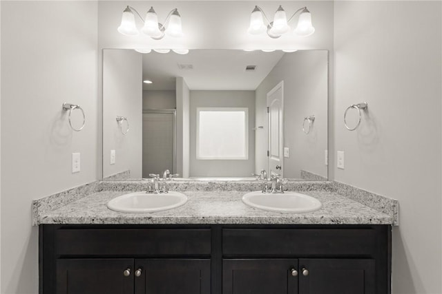 107 Heatherly Way, Brunswick, GA 31523 - full bathroom featuring double vanity and a shower with shower door